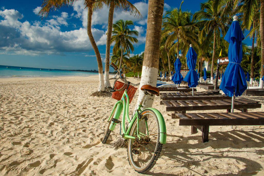 Popular beautiful beaches of Tulum in mexican state of Yucatan, bicycle tour for sun bathing