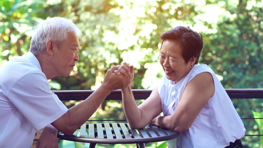 Asian elderly old couple compromising in game of love secret of lasting love