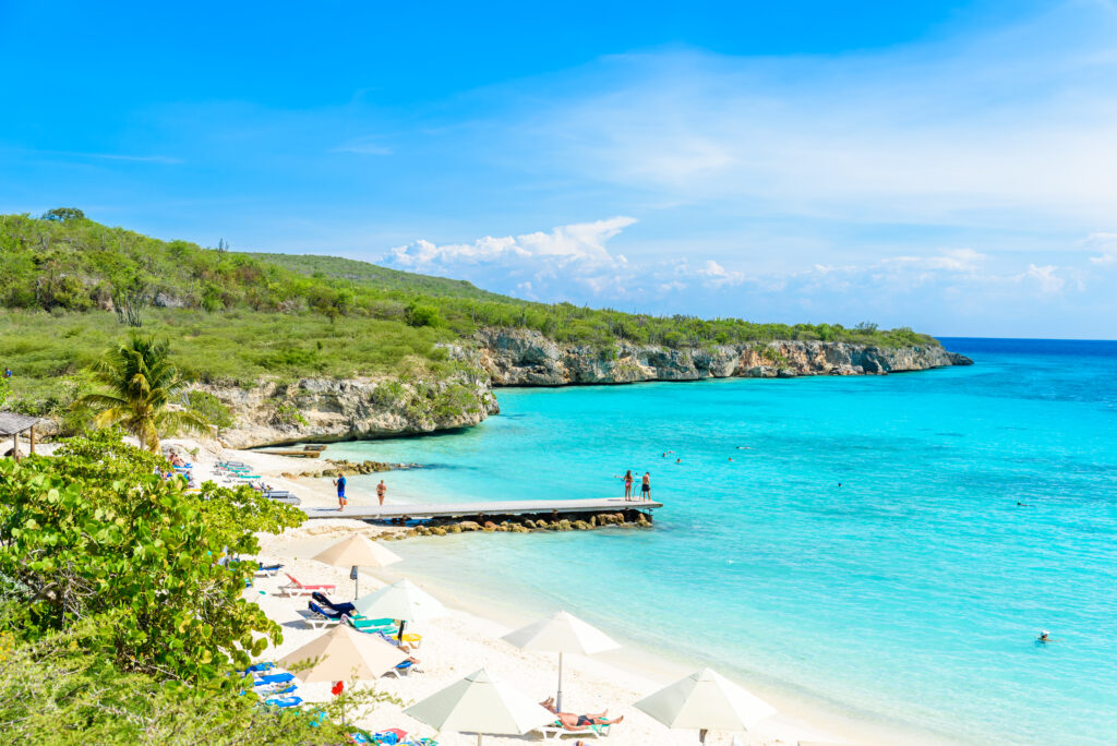 Porto Marie beach - white sand Beach with blue sky and crystal clear blue water in Curacao, Netherlands Antilles, a Caribbean Island