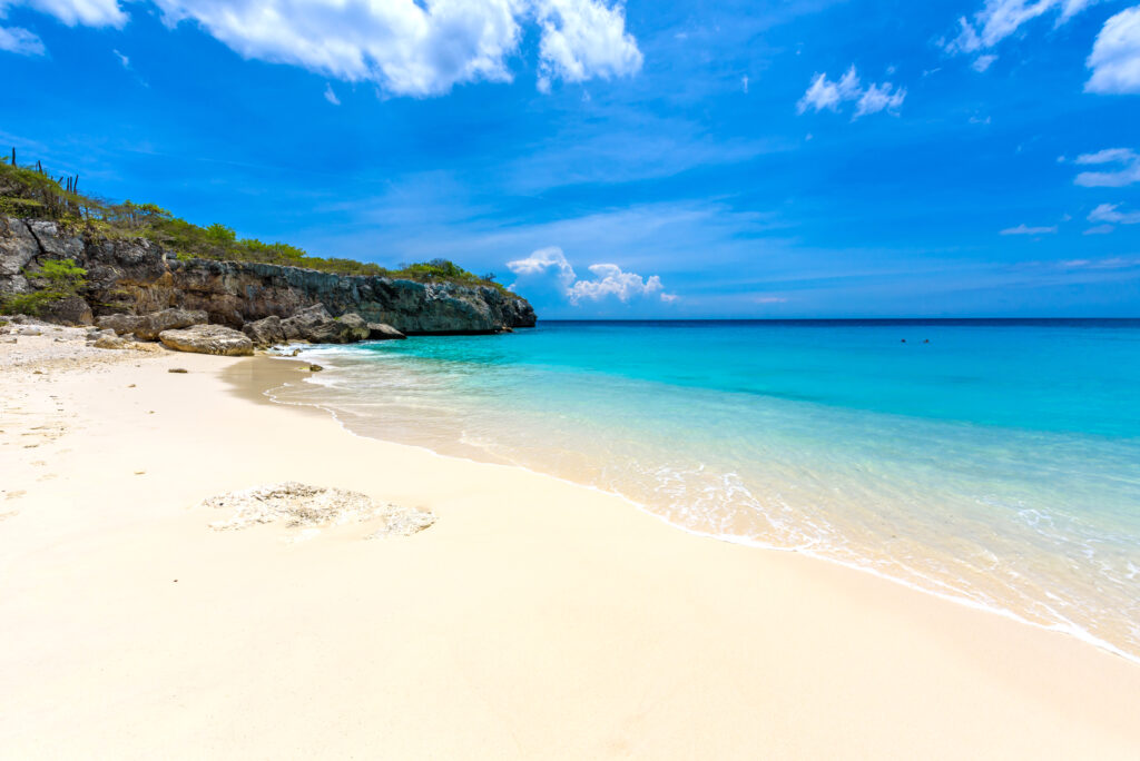 Little Knip beach - paradise white sand Beach with blue sky and crystal clear blue water in Curacao, Netherlands Antilles, a Caribbean tropical Island