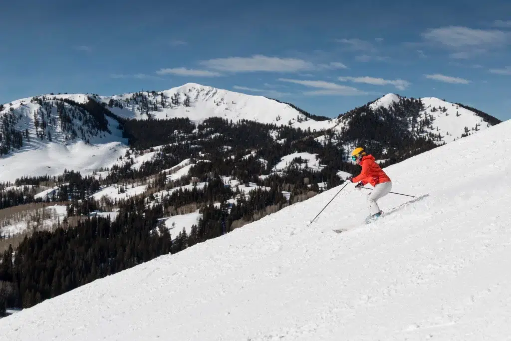 Woman spring skiing Deer Valley via Deer Valley Resort