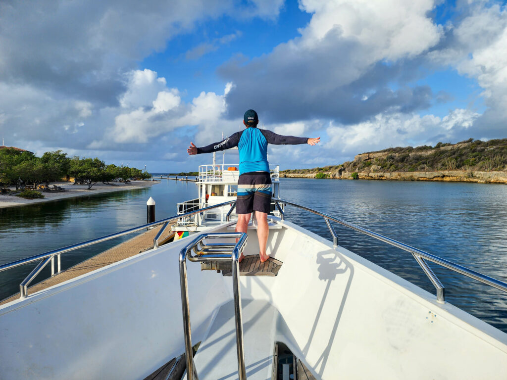 Ed at the boat's bow on Island Routes Miss Ann to Klein Curacao