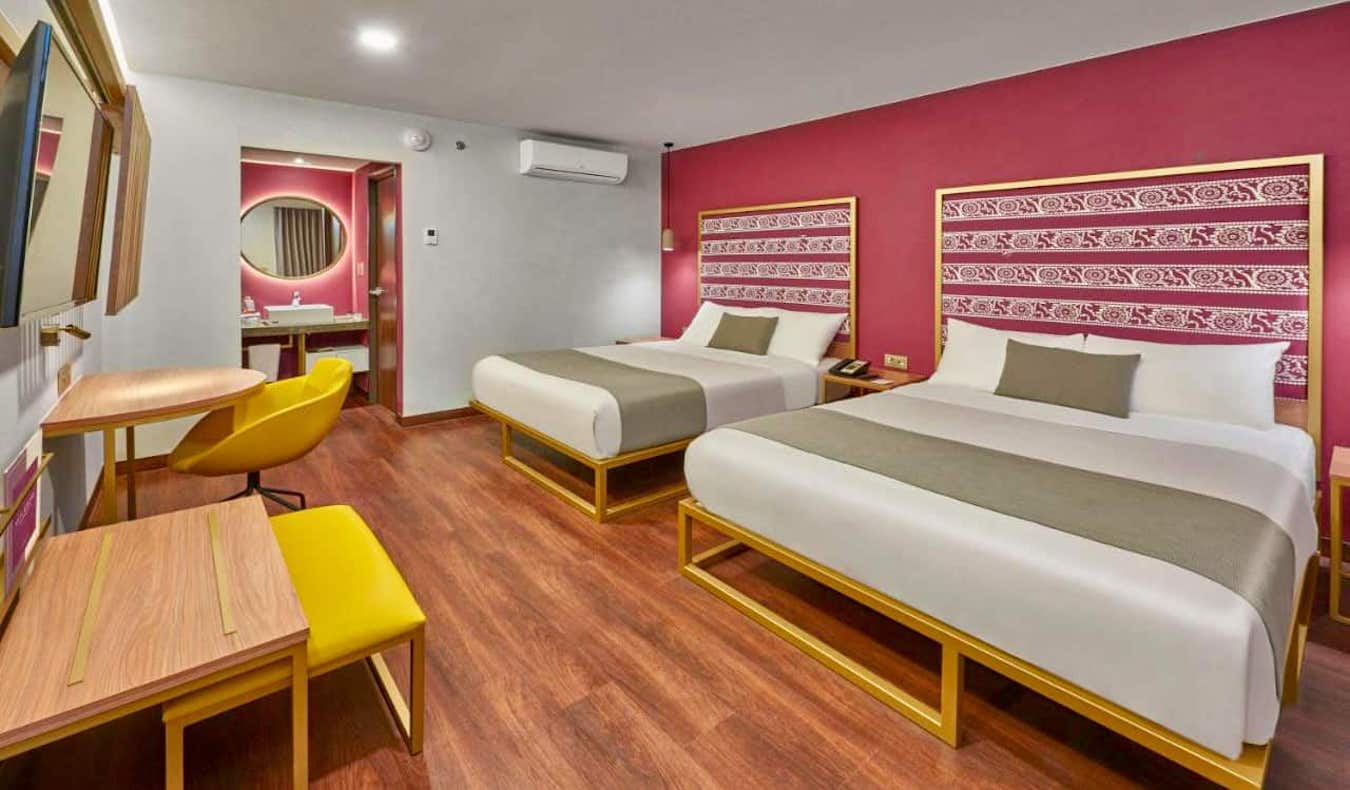 A pink hotel room at the photogenic City Centro hotel in beautiful Oaxaca, Mexico