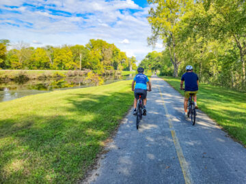 Two people riding Illinois bike trails