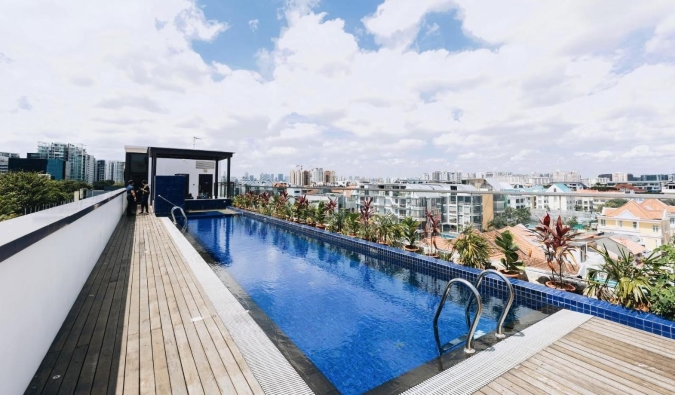 The infinity pool at Santa Grand Hotel overlooking the buildings of Singapore